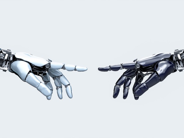 Hände von Robotern berühren sich
