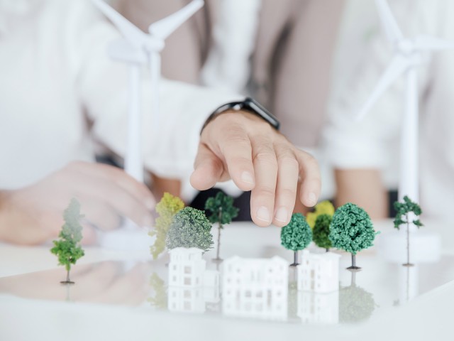 Small model trees and houses on a table